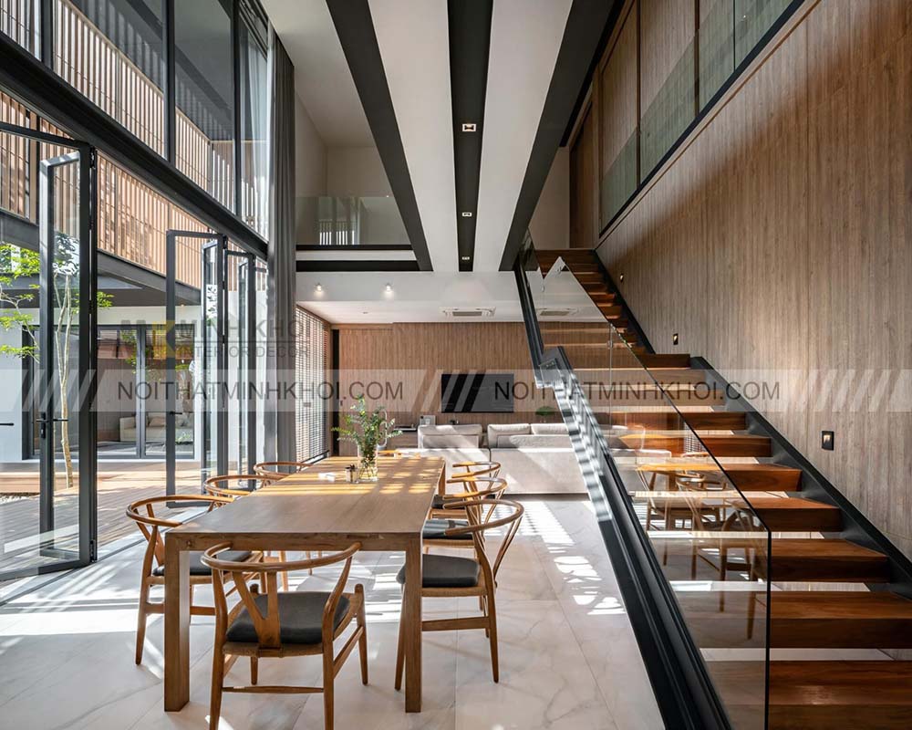 Một số mẫu thiết kế cầu thang kính kết hợp gỗ mới nhất hiện nay